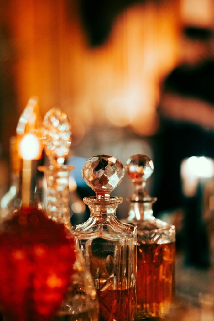 Antique glass decanters, like a perfumer's materials laid out for blending