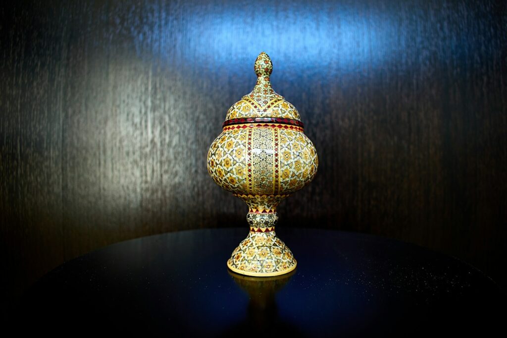 An ornate lidded jar with geometric inlay, like those used to keep precious oud