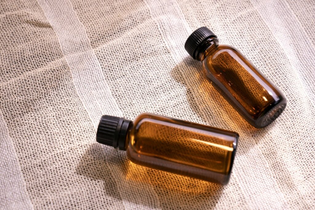 Two dark glass bottles, which protect fragrance from light